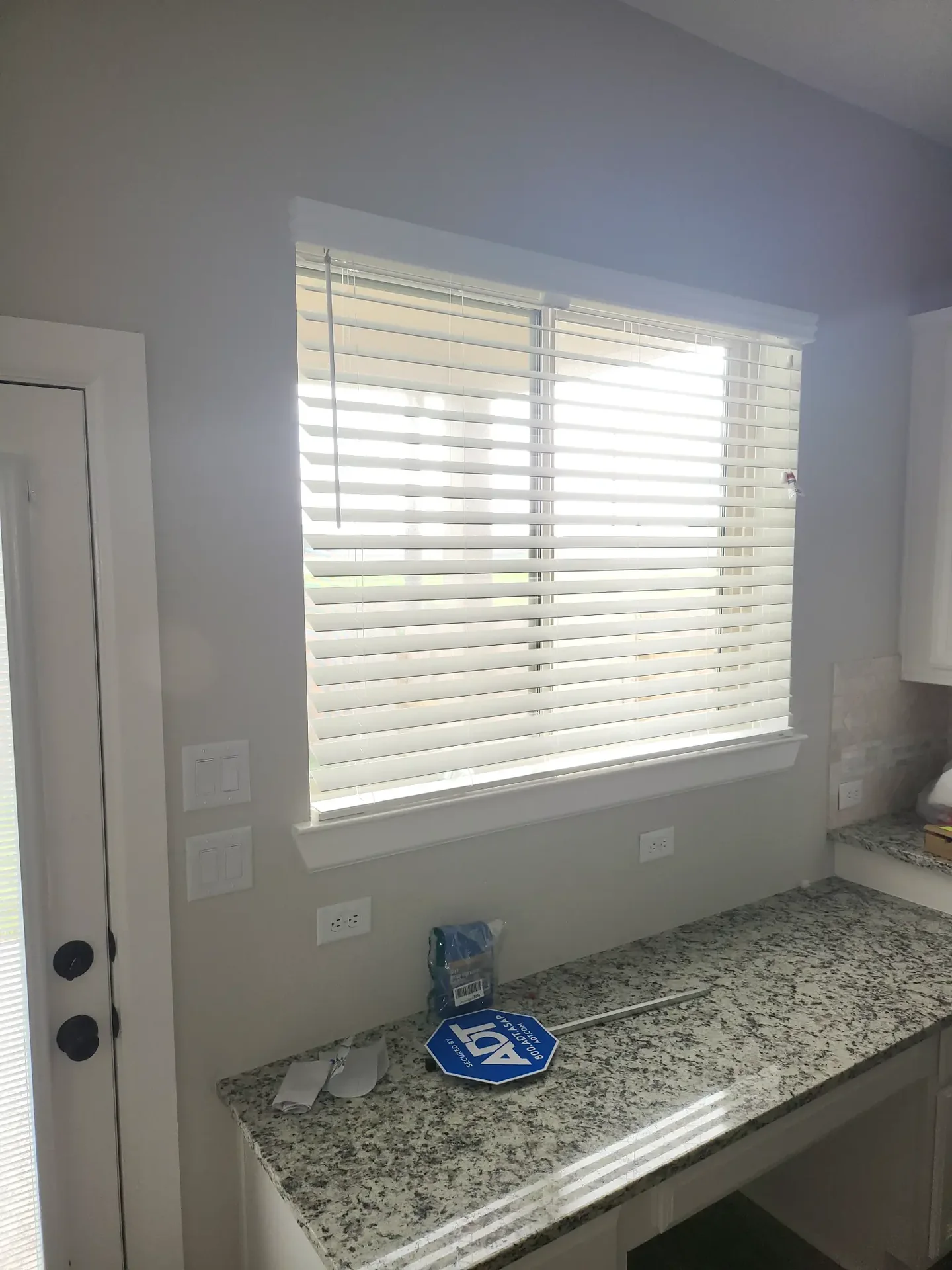 White faux wood blinds in kitchen — The Blinds Tech