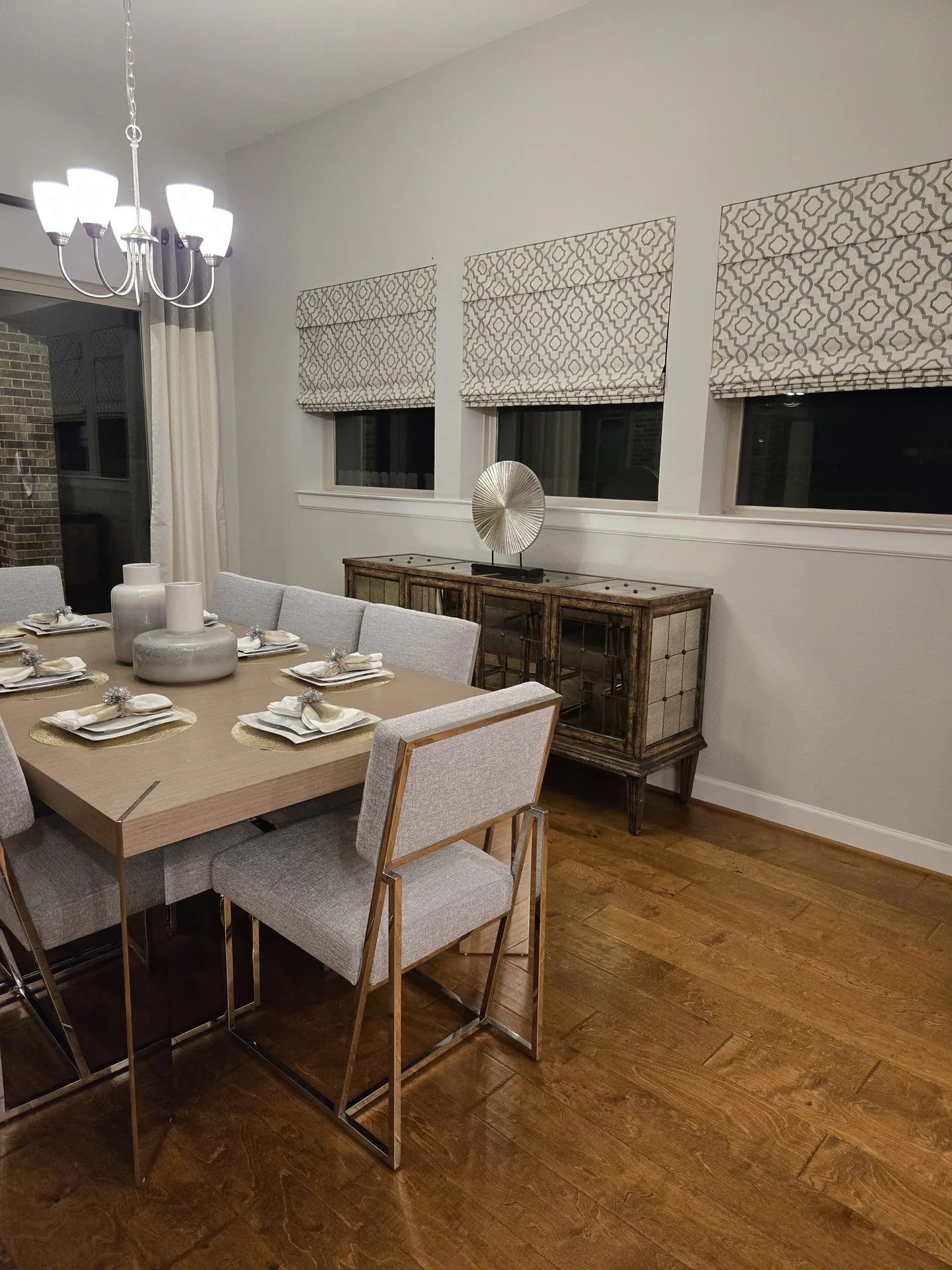Dining room with patterned roman shades — The Blinds Tech