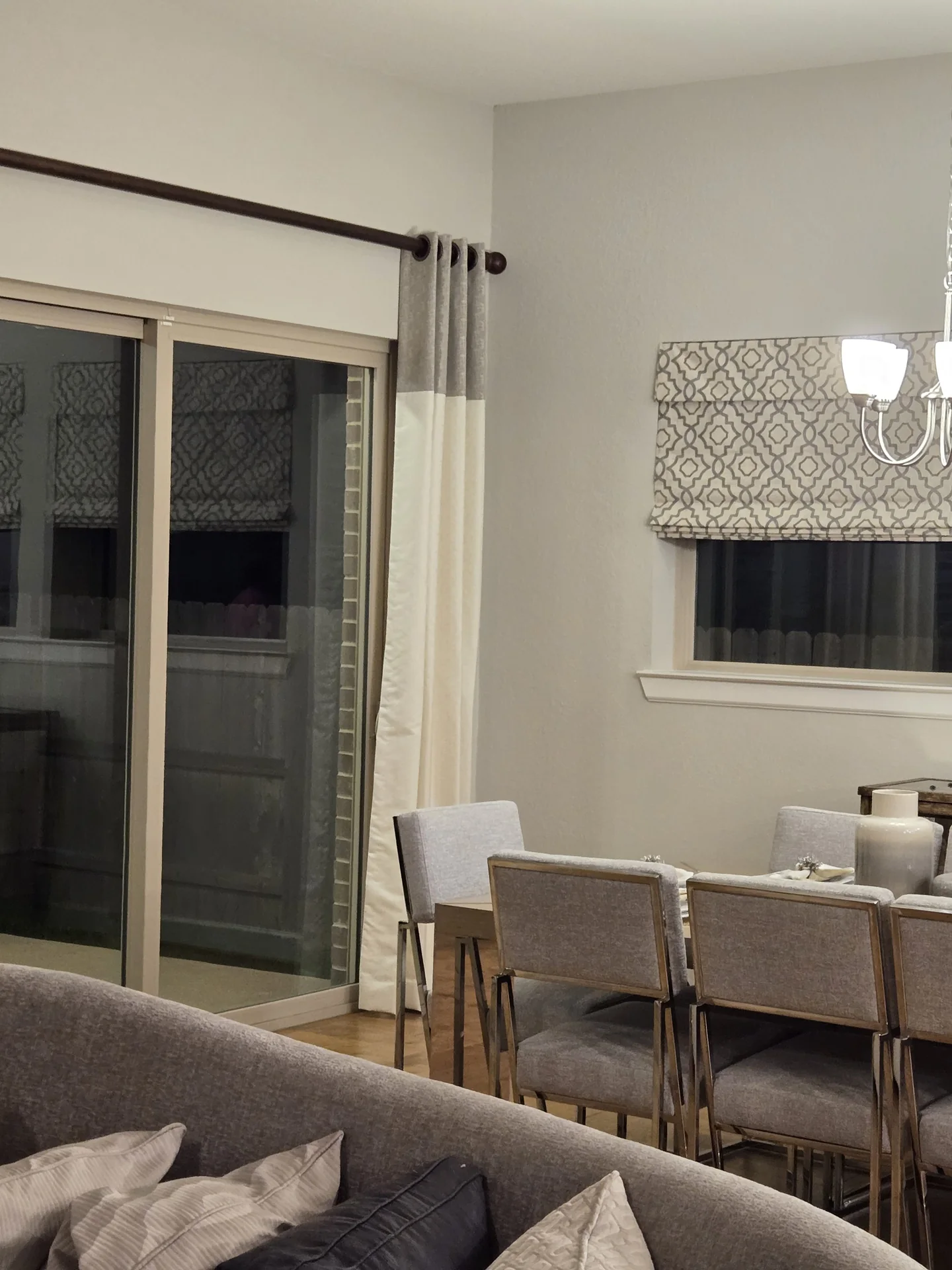 Living room with drapes and roman shades — The Blinds Tech