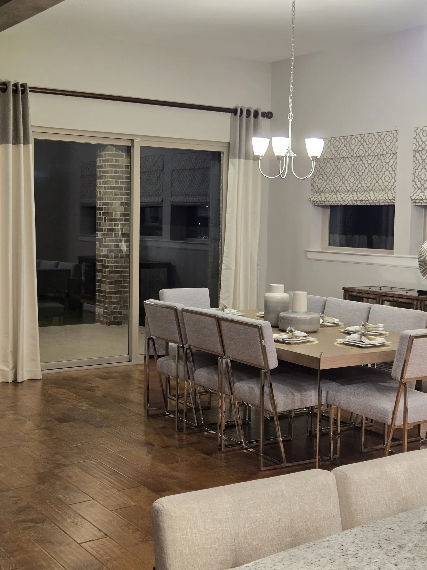 Dining room with drapes and roman shades — The Blinds Tech Houston